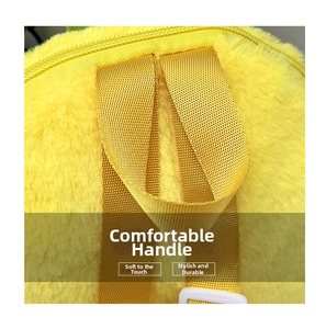 Detail of the yellow plush backpack showing durable nylon handle and soft fuzzy texture