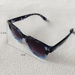 Detail view of marble pattern sunglasses frames with dimensions 4.8cm height and 15cm width