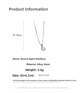 Detail view of cat eye stone necklace with dimensions 42cm plus 5.7cm extension chain