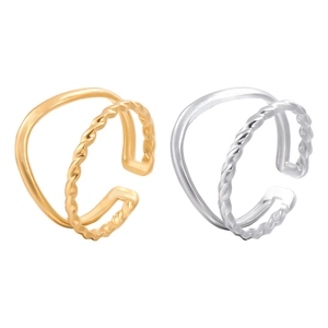 Close-up of double-layered open rings in gold and silver with twisted rope design