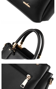 Close-up of black PU handbag showing golden metal hardware, logo plate and stitching