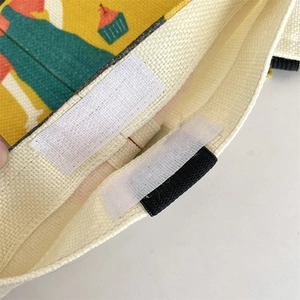 Detail of canvas tissue holder with cartoon prints and velcro closure mechanism