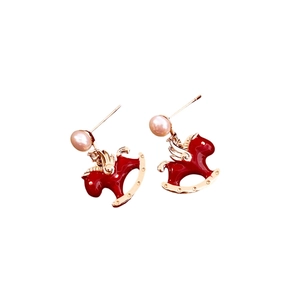 Gold plated rocking horse earrings with red enamel wings and white pearl accents