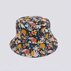 Detail showing the colorful floral print pattern on a black cotton bucket sun hat