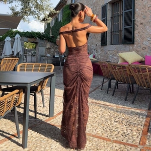 Detail of dark brown lace maxi dress with backless design and ruched hip detailing
