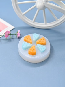 Detailed view of round silicone mold with six triangle cheese slice cavities for DIY