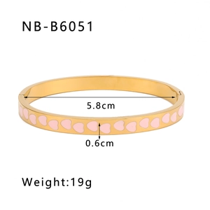 Top view of gold-plated stainless steel heart bangle with pink enamel and dimensions detail