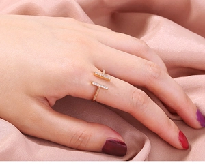 Detailed close-up of golden adjustable ring with micro-pave white zircon stones