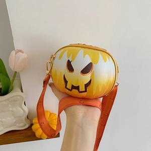 Close-up of a pumpkin-shaped crossbody bag with a smiling face for Halloween theme