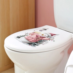 Close-up of cute snowman decal with pink coat on white toilet seat for Christmas decor