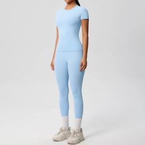 Women's light blue yoga set with short sleeve t-shirt and high waist compression leggings