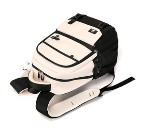 Detail view of large capacity black and white backpack with side pockets and zippers