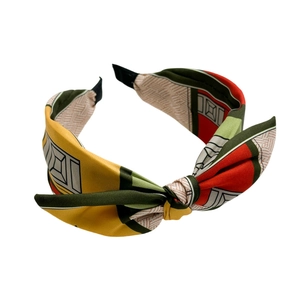 Vintage knotted wide headband featuring a colorful geometric satin patchwork design