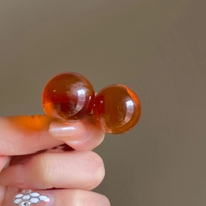 Detailed close-up of translucent amber resin beads for French vintage floral earrings