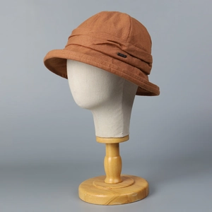 Elegant women's brown linen bucket hat in minimalist Japanese cloche style design