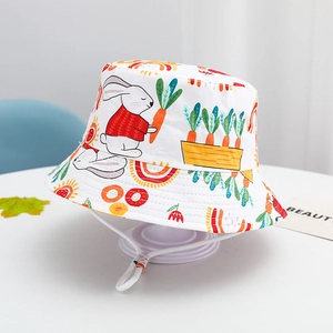 Detail of white cotton sun hat with cute rabbit pattern and adjustable drawstring