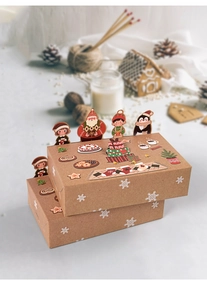 Close-up of festive Kraft paper gift boxes with cute animal illustrations and 3D toppers