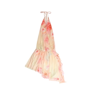 Detail of summer halter dress featuring yellow fabric with pink hibiscus floral pattern