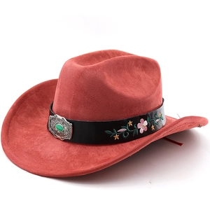 Close-up of red suede cowboy hat featuring floral embroidery and turquoise silver buckle