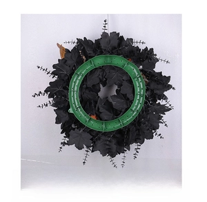 Back view of black Halloween maple leaf wreath showing green plastic support structure