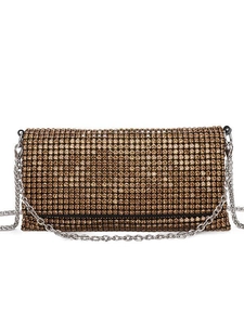 Elegant evening clutch bag with gold rhinestones and silver metal chain strap