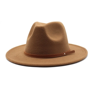 Close-up of brown wool fedora hat featuring a leather band and silver rivet detail