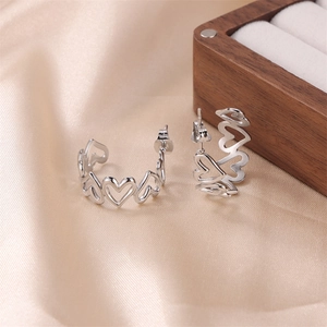 Minimalist silver stainless steel C-shaped hoop earrings with hollow heart link design