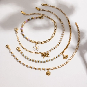 Set of four 18K gold plated stainless steel floral bracelets with colorful beads and charms
