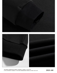Detail of ribbed cuffs and high-density cotton fabric texture on a black sweatshirt