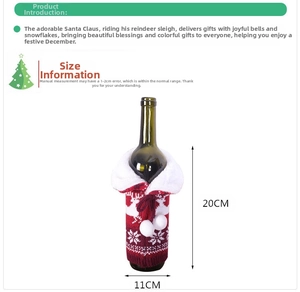 Detail of red Christmas wine bottle cover with white reindeer knit pattern and pompom