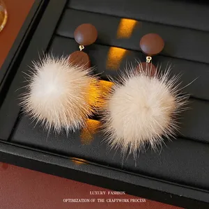 Vintage wood and faux fur ball earrings in brown and beige with gold metal accents