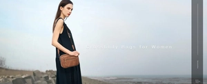 Deep brown leather crossbody bag with multiple zip compartments and adjustable strap