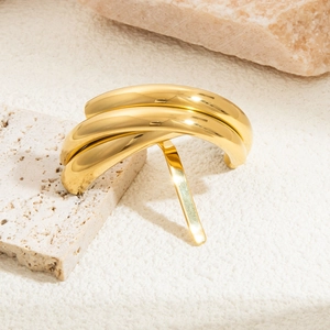 Close-up of triple-layered U-shaped gold hair accessory with a mirror-polished finish