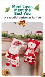 Close-up of Santa and Snowman knitted Christmas stockings hanging on fireplace mantel