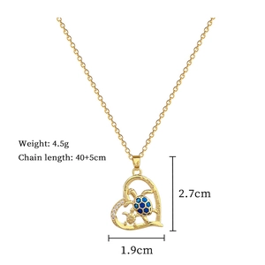 Detail view of gold sea turtle heart necklace with blue enamel and dimensions specifications