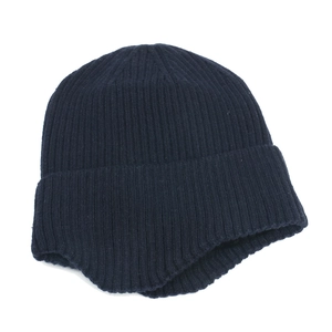 Detailed view of navy blue ribbed knit earflap beanie with thick thermal texture