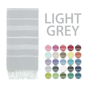 Striped Turkish beach towel in light gray with fringe detail and multi-color options