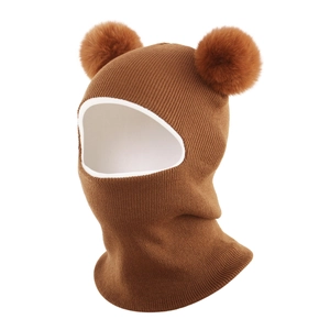 Detailed knit texture and double pom-poms on the brown winter baby balaclava hat