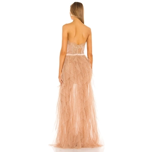 Elegant champagne tulle ball gown with strapless backless design and layered ruffles