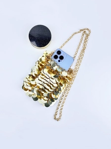 Mini gold sequin handbag with chain strap, showing space for phone and makeup compact