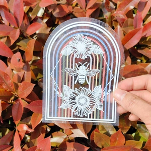Rainbow prism window sticker featuring a bee and sunflower with colorful suncatcher effect