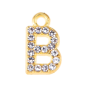Macro shot of gold letter B pendant with sparkling crystal rhinestones inlay details