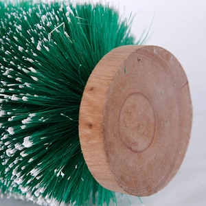 Miniature sisal Christmas tree with wooden base and snow-tipped green bristles