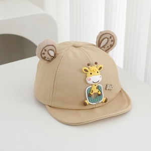 Detailed macro shot of beige baby baseball cap featuring cute plush giraffe and small ears