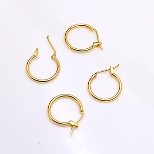 Close-up of four 18k gold plated C-shaped earring hoops for DIY jewelry making