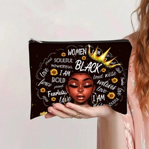 Detail of canvas pouch featuring a black queen crown print and motivational words
