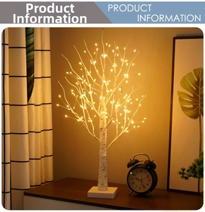 Cozy home decor showing a birch tree LED lamp with warm lights on a nightstand