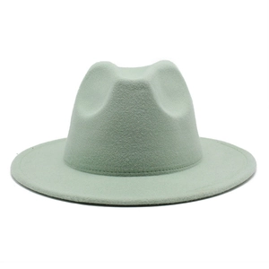 Close-up of mint green wool felt fedora hat featuring classic creased crown and flat brim