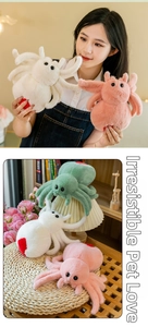 Macro detail of plush spider doll in pink and green with soft faux fur and large eyes