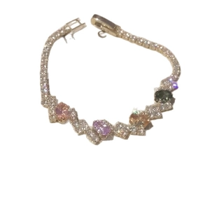 Elegant silver tennis bracelet featuring colorful oval zircons and shimmering accents